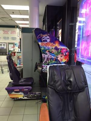 Massage chair in foreground, plus video games