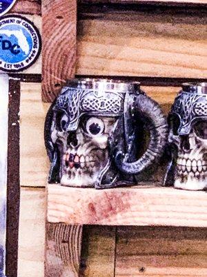 Closeup of a skull mug with Google eyes added