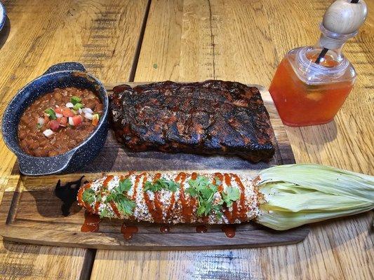 The Backyard Ribs with elote and baked beans