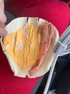 Why I called in the first place. A raw slice of cheese on a cold wrap with undercooked bacon........