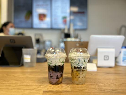 Combination 1 on the left.  Mung beans. Taro. Grass jelly.  Top with coconut milk.  

Che Thai on the right.