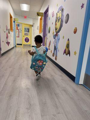 My little one walking independently into her classroom