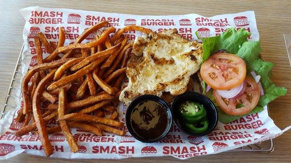 Grilled chicken on multigrain with lettuce, tomato, red onions, jalapeños, and BBQ sauce. Side of sweet potato fries.