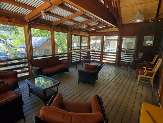 Screened patio seating at the Hostel