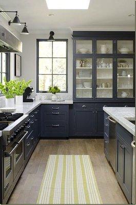 BLUE GRAY LOVELY The blue-gray cabinets in this dream kitchen are all sorts of amazing, and those glass cupboards certainly don't hurt!