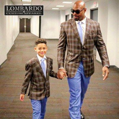 Tyrone Smith and his son. Matching suits.