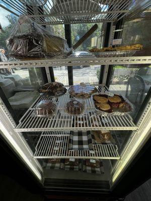 Bakery items in the front case near the register, outdoor exterior signage.