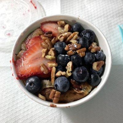 my build your own bowl: milk chocolate chip pancakes with maple syrup, strawberries, blueberries, and pecans