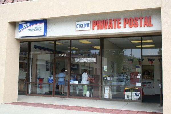 Front shows 2 entrances - left = USPS, right = private mail center