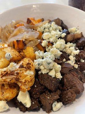 Steak with mushrooms, cauliflower and sweet potatoes and blue cheese crumbles.