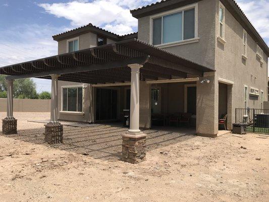 Elitewood aluminum lattice patio cover with roman columns and stone veneer