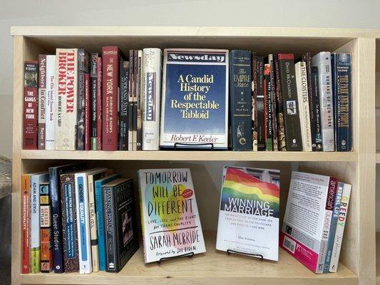 Local interest & LGBTQI books on the shelves.