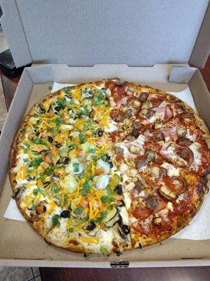 XL Pizza  half artichoke fiesta with white sauce the other half is the meat lovers with extra chicken added