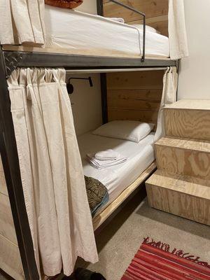 Bunk beds showing steps leading to upper bunk