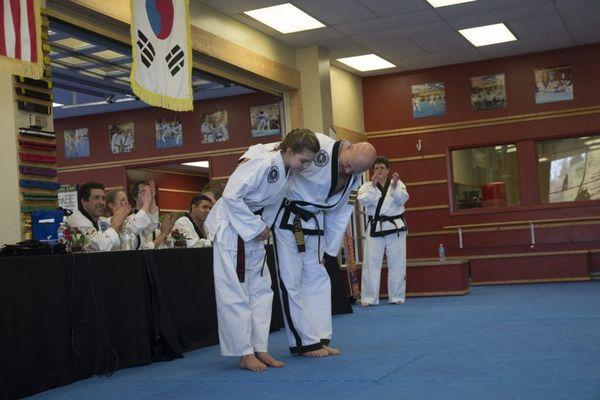 Asheville Sun Soo student receives Junior 1st degree black belt after successful testing.