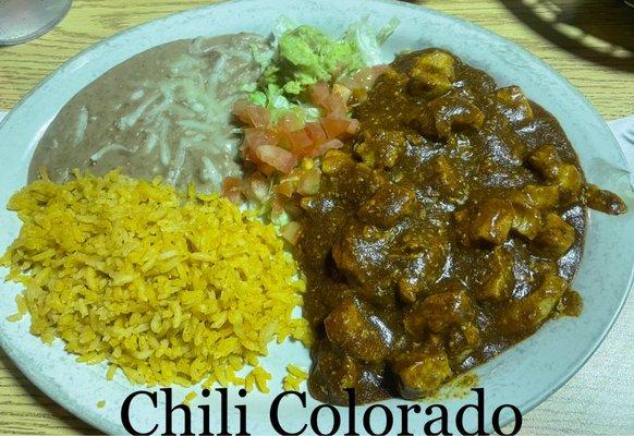 Chili Colorado, served with rice, refried beans and guacamole.  Delicious!