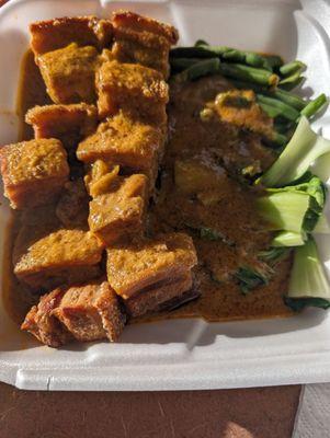 This is called crispy kare kare.It's with lechon kawali with bok choy, long beans and eggplant topped with peanut sauce. I