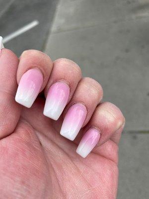 Dark pink and white ombré nails.