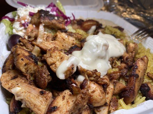 9. Shawarma Platter  Delicious, tender chicken, perfectly seasoned rice, creamy hummus, and tangy Greek salad!