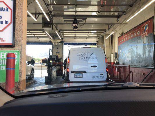 A car being serviced. View from my dashboard.