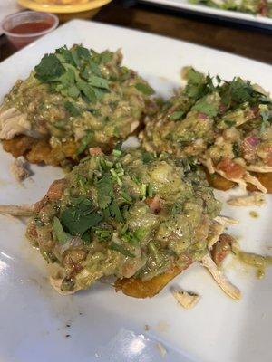 Tostones topped with shredded chicken and guacamole! Probably the best guac I've had.