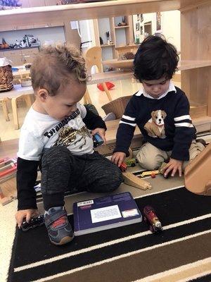 My son playing trains with his classmate (pre-covid).