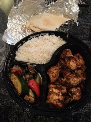 Grilled chicken platter with rice vegetables and pita