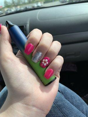 The nails I got. My dress has flowers all over for it and it was pink. I asked for him to bring those colors into my nails