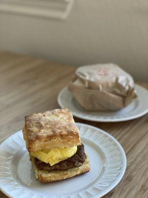 Sausage egg and cheese biscuit sandwich. Spicy chicken sandwich is still wrapped.