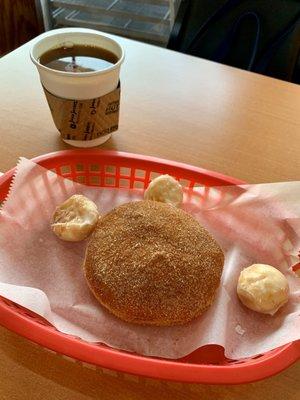 Raspberry-filled donut and an excellent cup of coffee