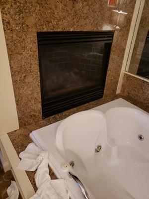 Weird place for a fireplace, over the jacuzzi that barely worked