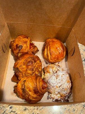 Prosciutto and Swiss on the left (our favorite) and pain au chocolate on top right and almond croissant on bottom right (a sweet must).