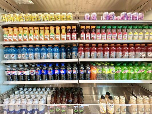 Beverages in a refrigerated display case.