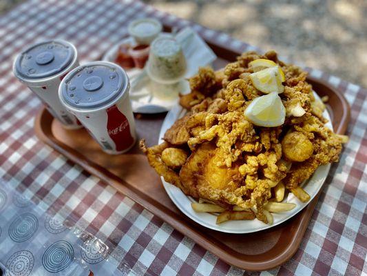 The "Fisherman's Platter" is a fried seafood platter that contains codfish, shrimp, scallops, whole clams, clam strips, fries and coleslaw