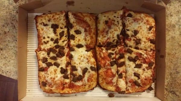 Here's the hacked up pizza, notice the pizza isn't filling the box. Company's rip you off while making more money.