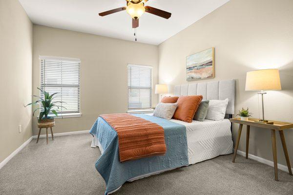 Bedroom with ceiling fan at the Villas at Medical Center