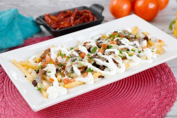 JESSE LOADED FRIES
Grilled steak fries topped with creamy cheese dip pico de gallo and sour cream.