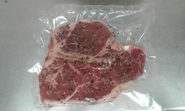 Steak rubbed with signature seasoning.