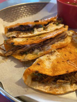 Birria $17.00 Braised short rib in chili peppers, herbs and spices, served in a quesadilla, onions, ciantro, consome and a side of rice.