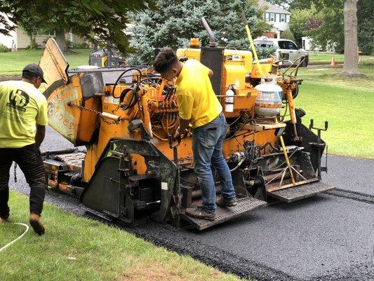 Laying asphalt in a new driveway