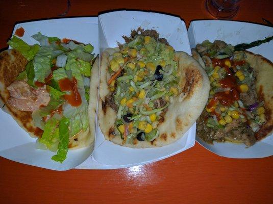 Shrimp, braised beef, jerk chicken naan tacos