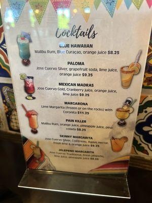 Regular drink menu. Happy Hour cuts price in half for house margarita!