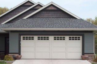 Garage doors with insulated steel construction, fashioned to resemble the elegant wood designs