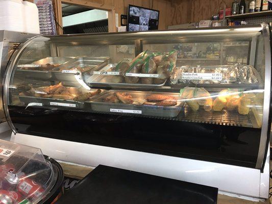 Their little hot bar with fried chicken, hot wings, boiled corn and potatoes and other Cajun food items.