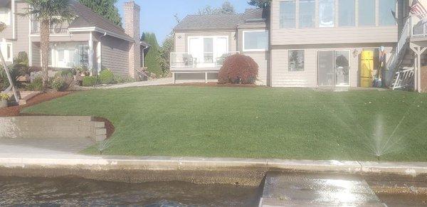 New patio, retaining wall, irrigation system and lawn