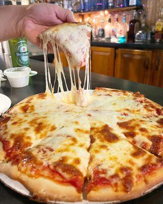 8-cut cheese pizza from Wick City Saloon, Kittanning PA. Hot and cheesy. Nice for a bar pizza!