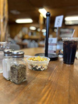 Just a feel of the room with street corn and coke.