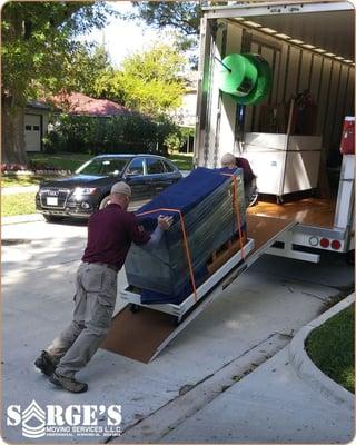 Our movers are strong and well-dressed in polo shirts and khaki pants/shorts.