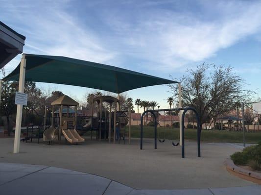 Small park and basketball hoop behind the community center