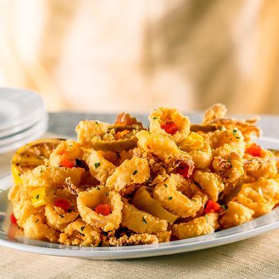 Pan-Fried Calamari with Hot Cherry Peppers �� Our signature appetizer - crisp and golden with a fiery flavor.